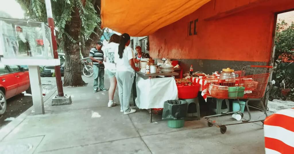 Street food stand selling tlacoyos at Mixiuhca market in Mexico City